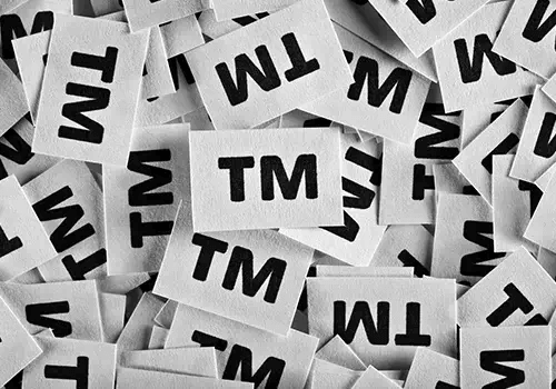 Multiple sheets of paper with TM logo on them